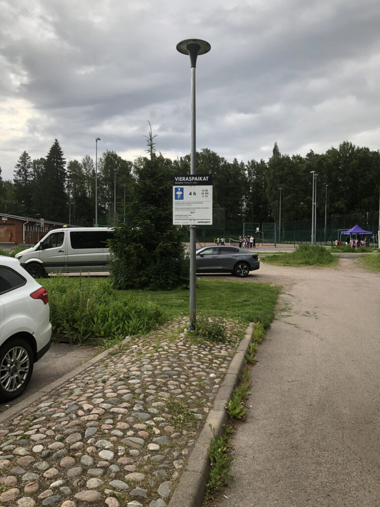 Picture of a sign telling about the parking lot.
