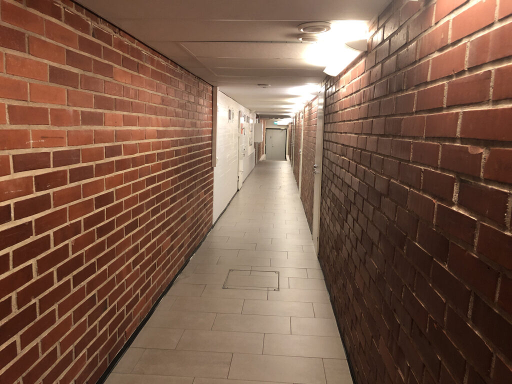 Corridor to the locker rooms.