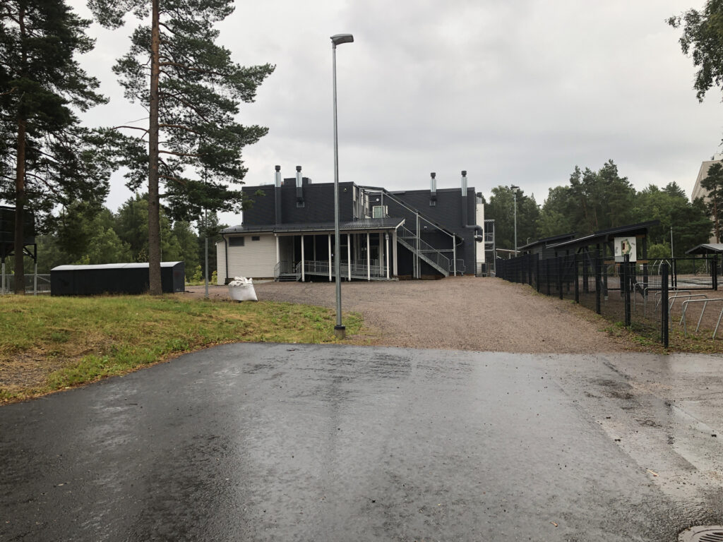 Picture of a gravel parking area after a parking lot.